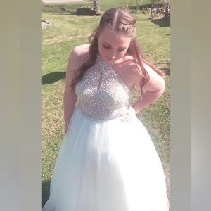 Size 14 prom dress. Worn only one time and in like new condition.